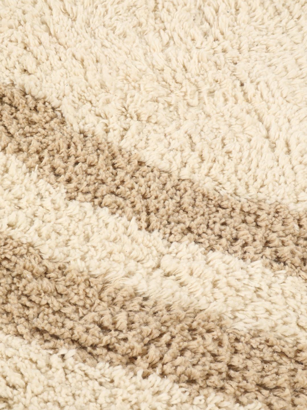 Tapis de bain rond beige avec motif circulaire