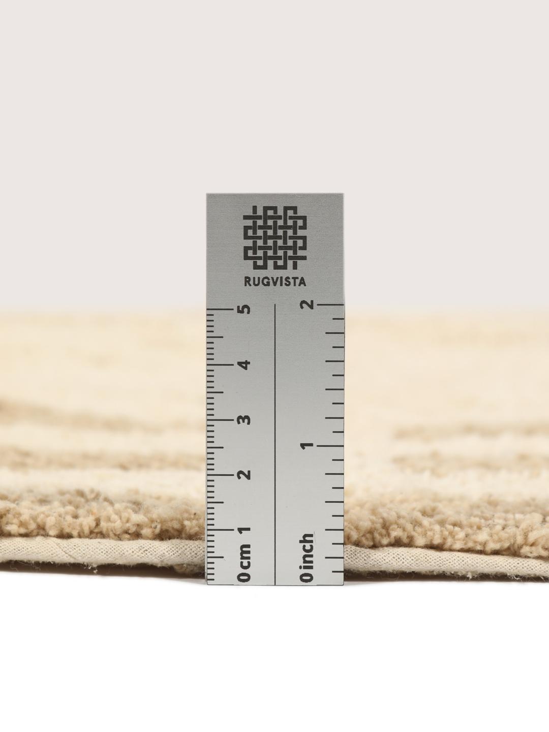 Tapis de bain rond beige avec motif circulaire