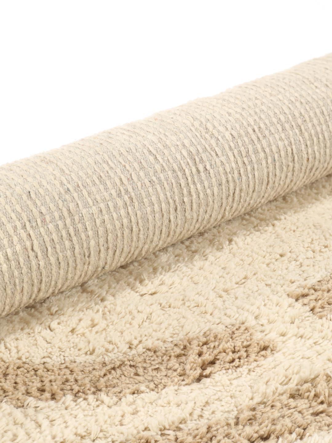Tapis de bain rond beige avec motif circulaire