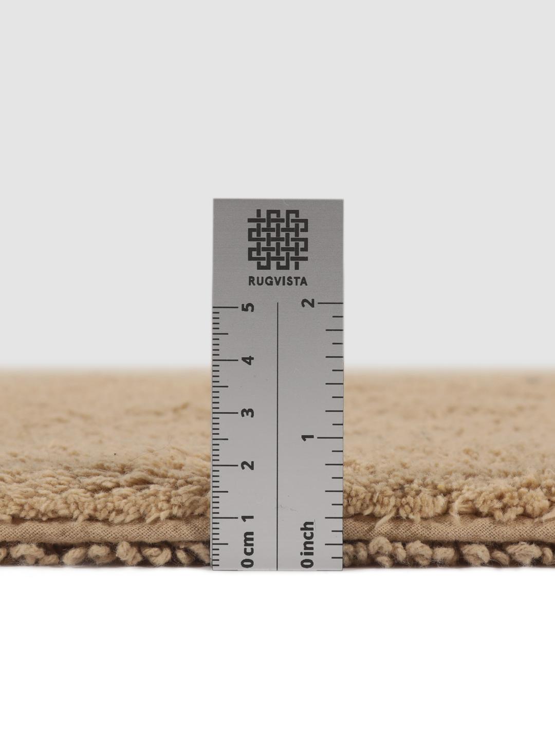 Beige bademåtte med frynsedetaljer