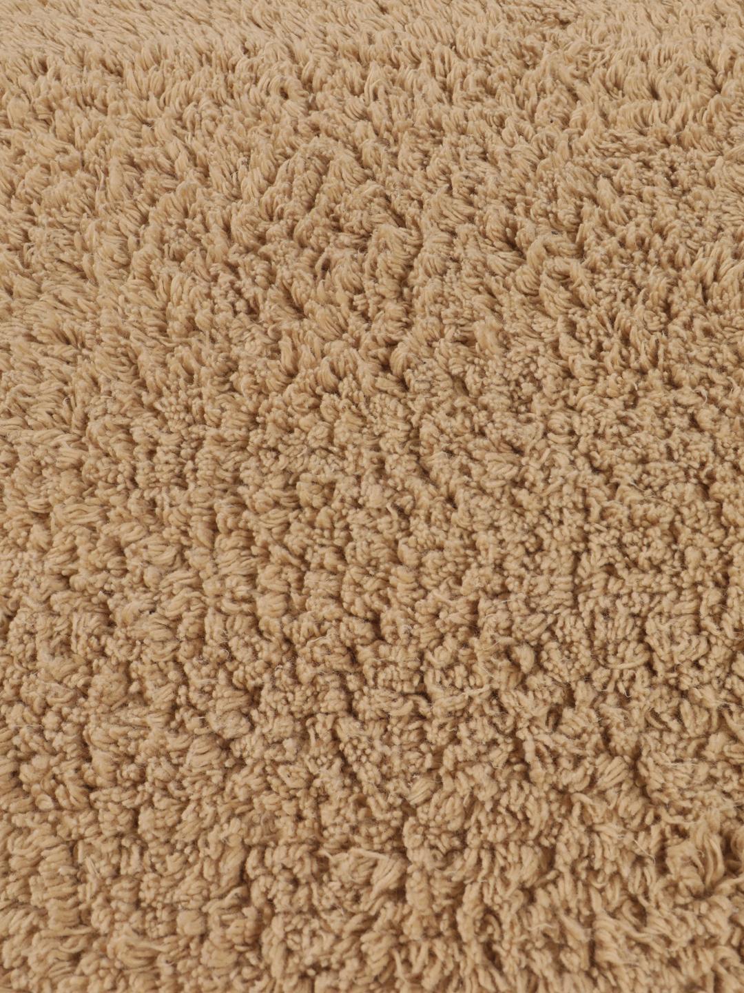 Beige bademåtte med frynsedetaljer
