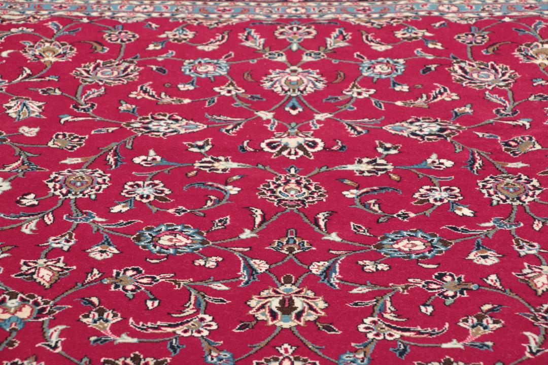 Handgeknoopt Keshan wollen vloerkleed in rood en donkerblauw