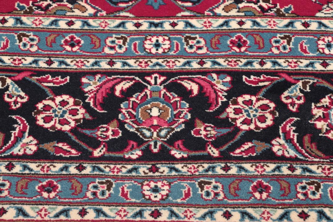 Handgeknoopt Keshan wollen vloerkleed in rood en donkerblauw