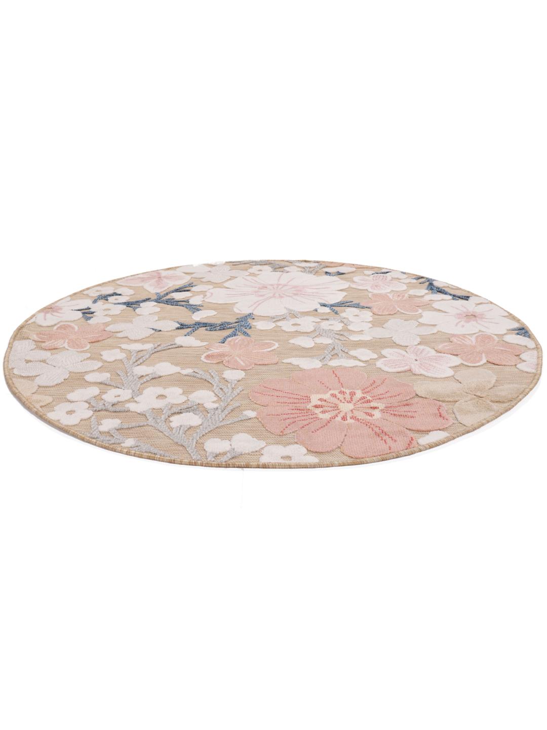 rundt beige og rosa tæppe med blomstermønster