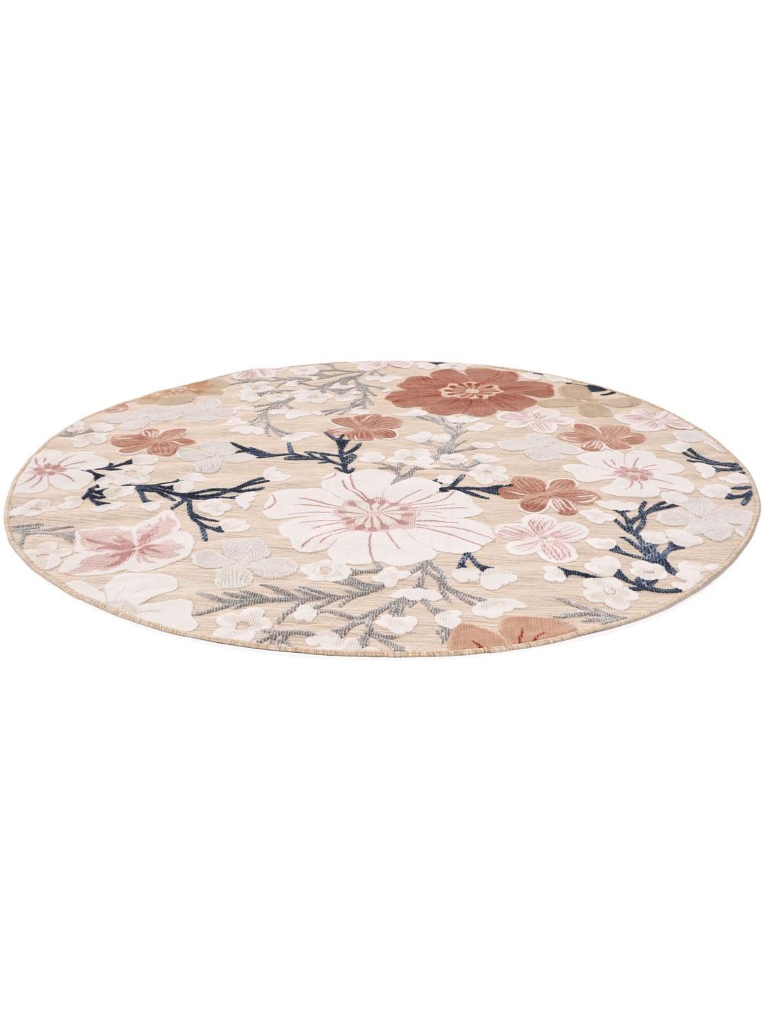 rond beige en roze tapijt met bloemenpatroon