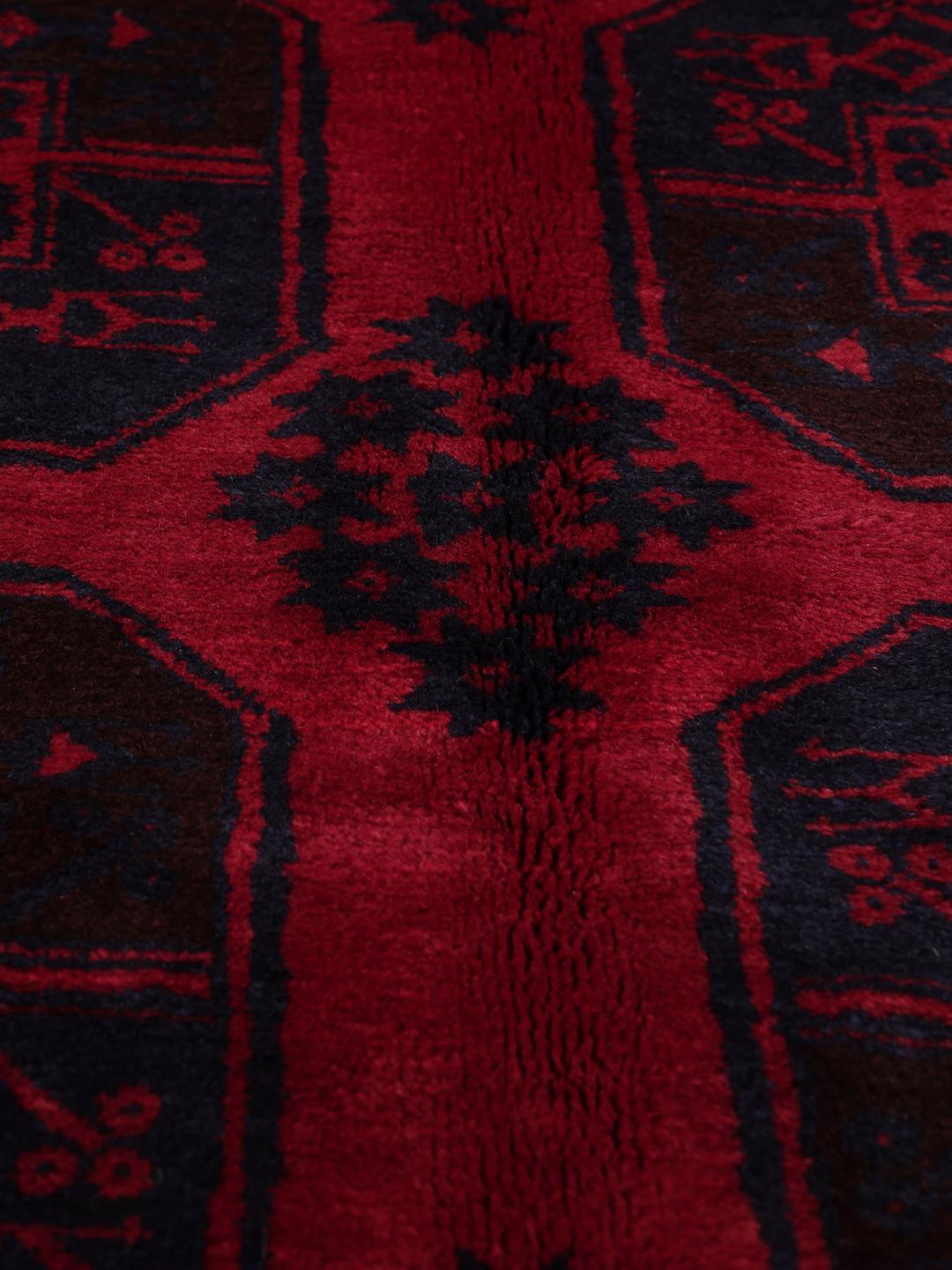 Handgeknoopte Beluch loper uit Afghanistan in dieprood met geometrische patronen