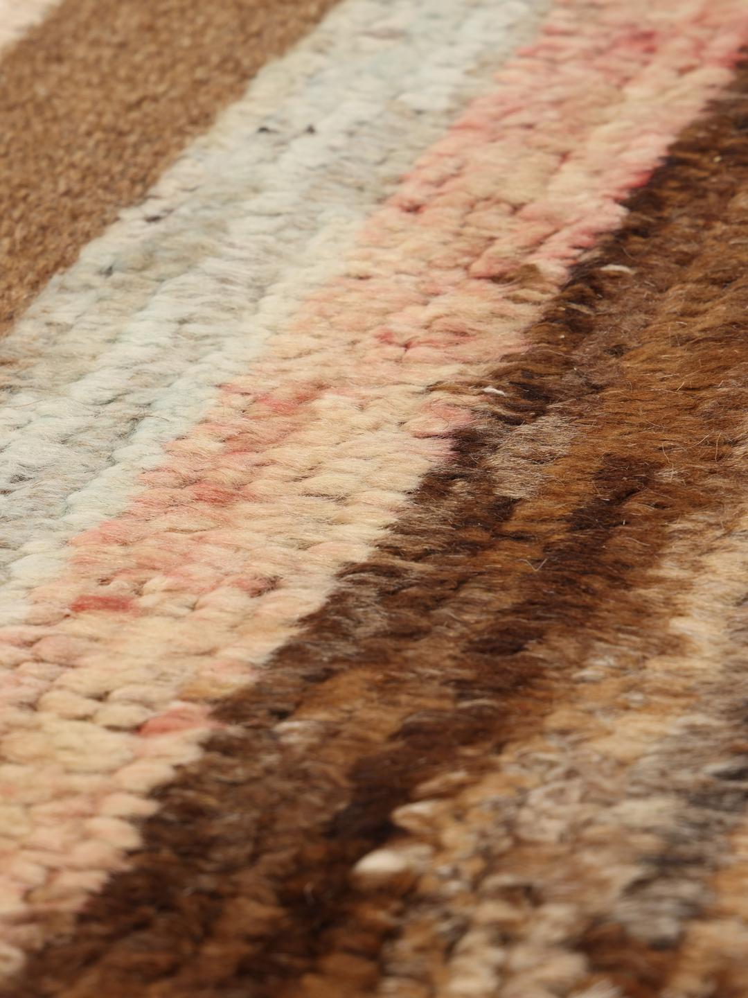 Hand-knotted rug from the Middle East with a geometric pattern in brown and beige tones.