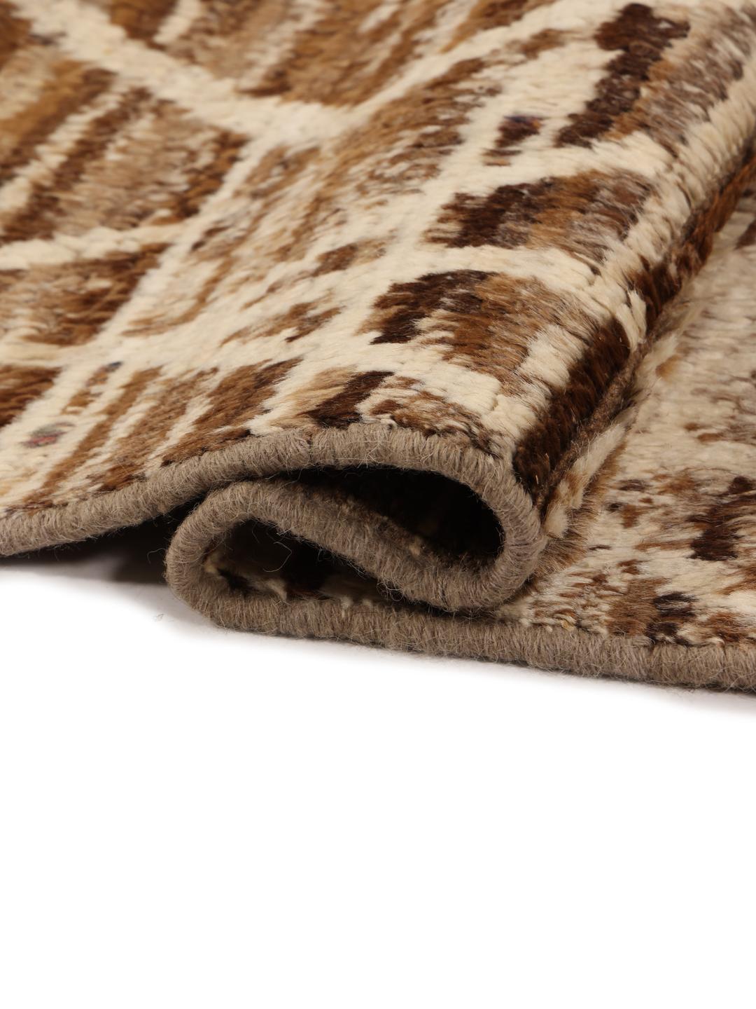 Hand-knotted rug from the Middle East with a geometric pattern in brown and beige tones.