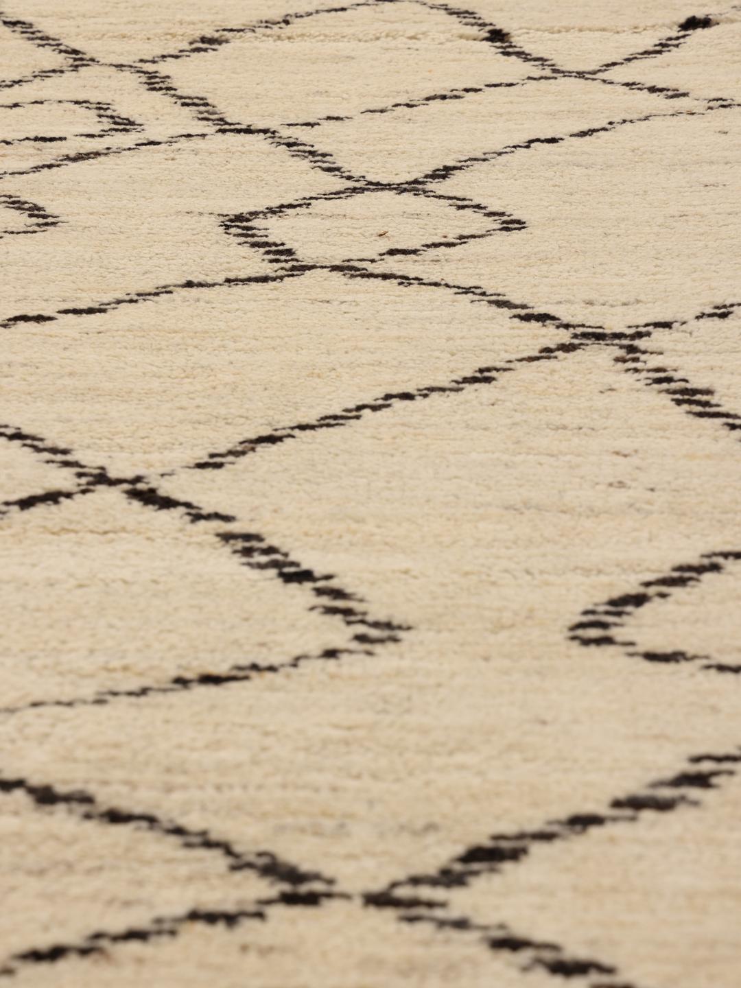 Hand-knotted Afghan Berber Style rug in beige with a geometric pattern.