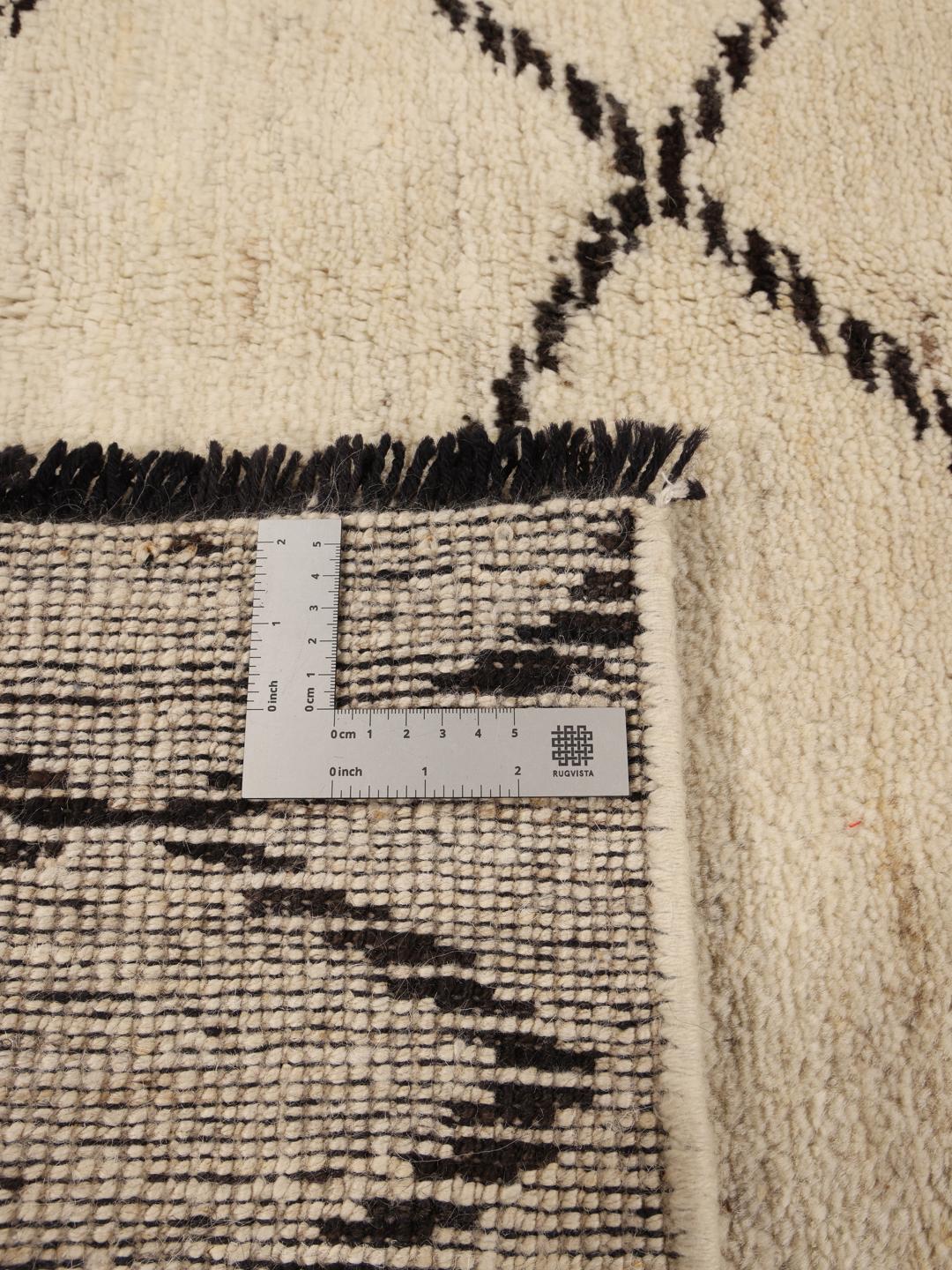 Hand-knotted Afghan Berber Style rug in beige with a geometric pattern.