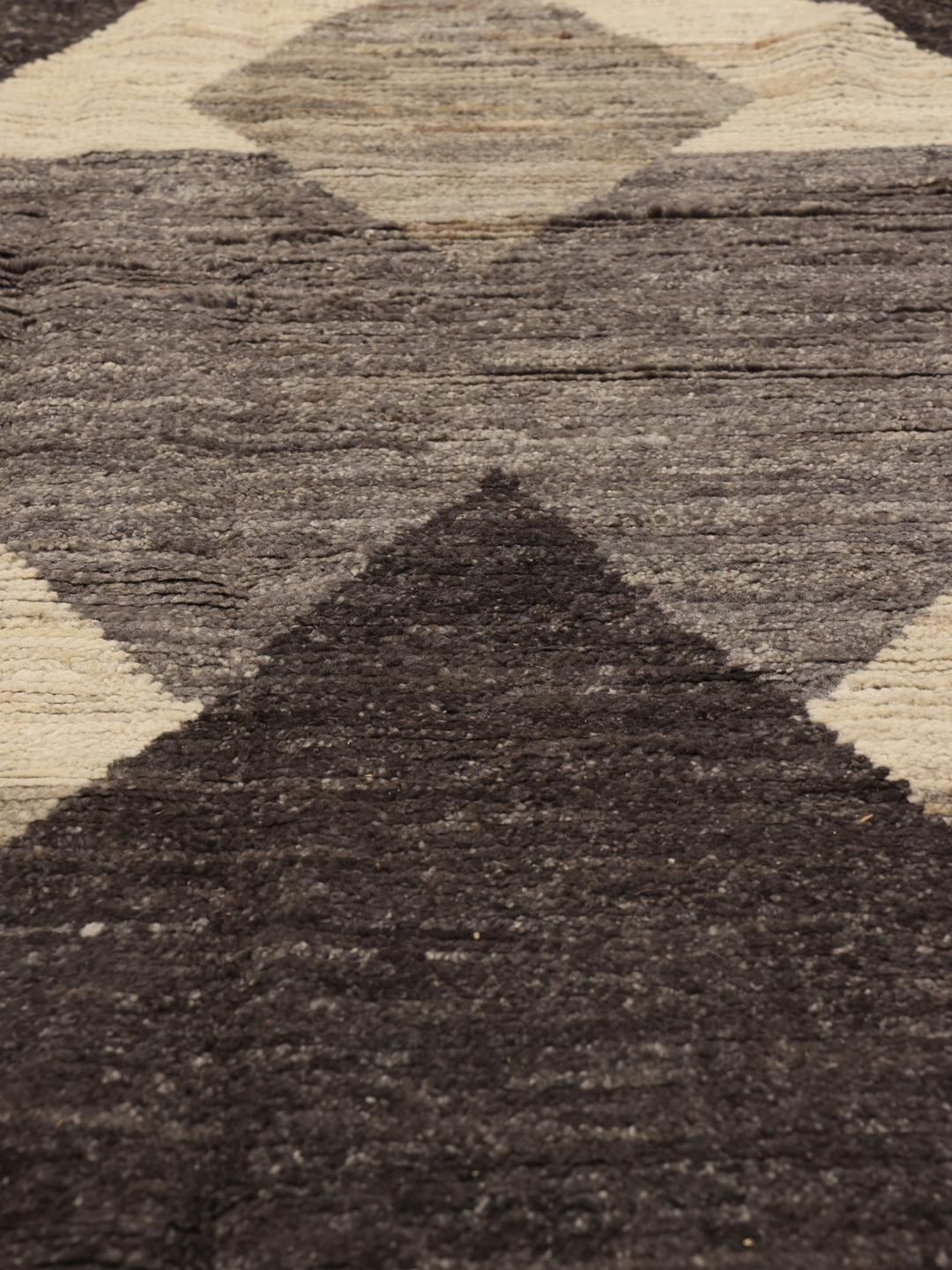 Hand-knotted Afghan rug with grey and cream geometric patterns
