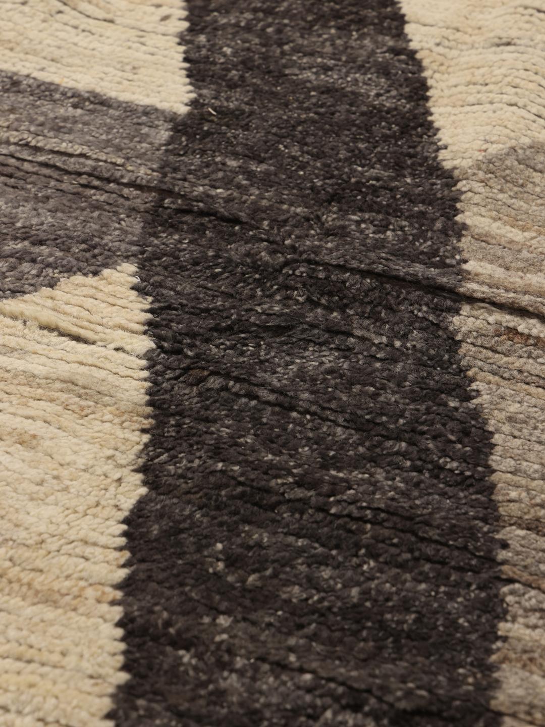 Hand-knotted Afghan rug with grey and cream geometric patterns