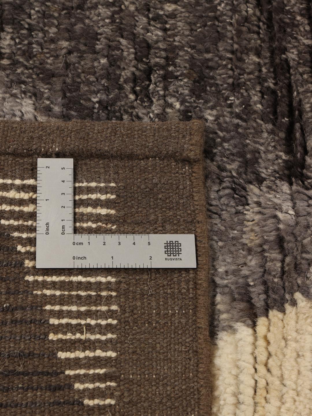 Hand-knotted Afghan rug with grey and cream geometric patterns