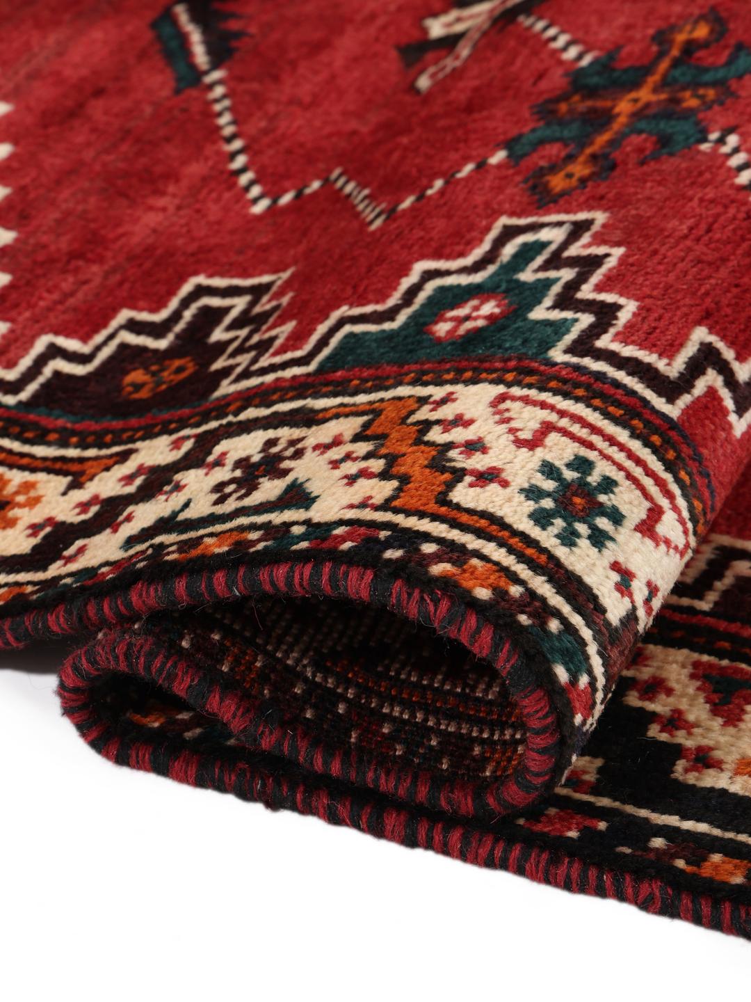 Hand-knotted Shiraz rug with geometric patterns in red and black
