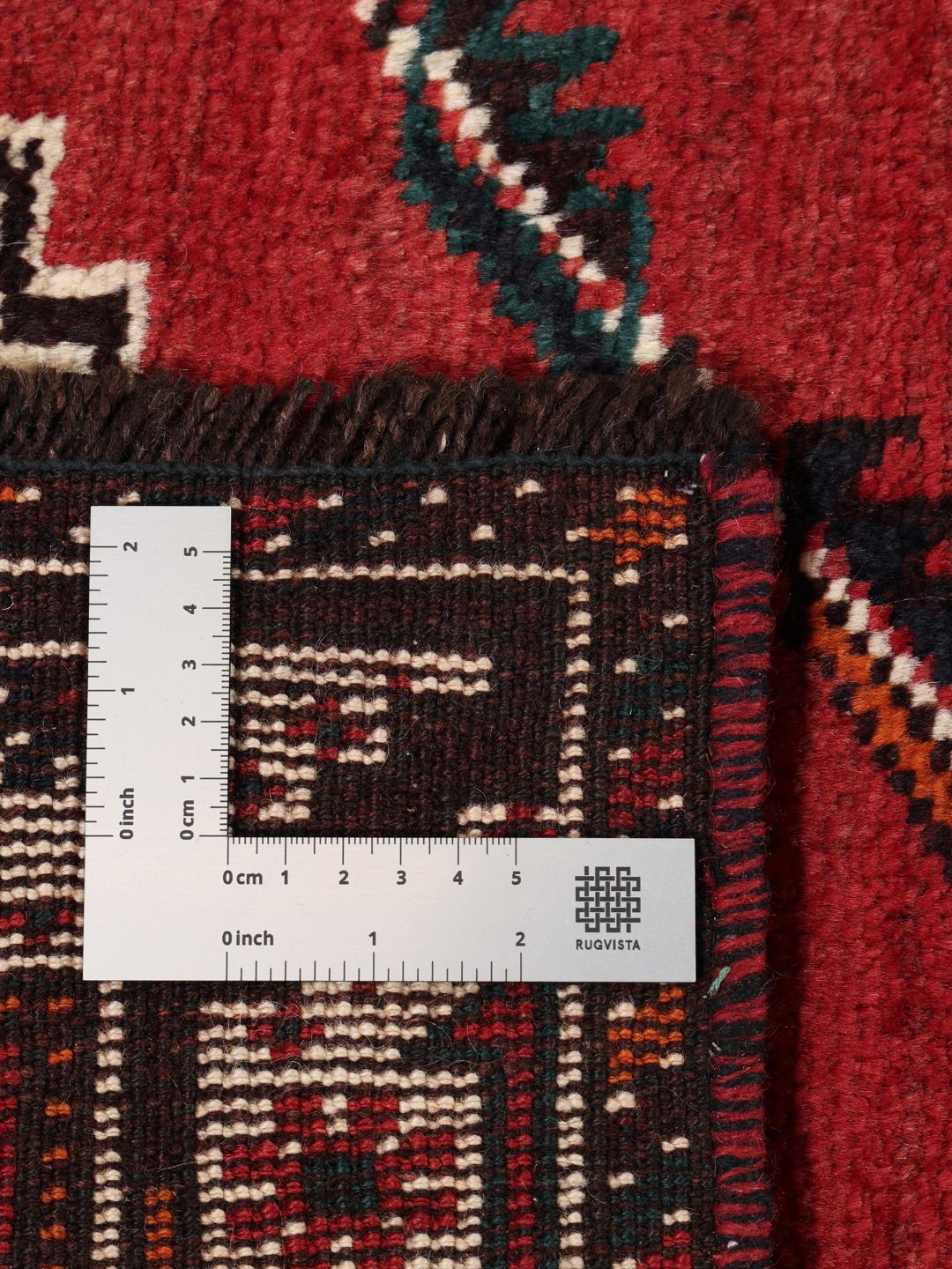 Hand-knotted Shiraz rug with geometric patterns in red and black