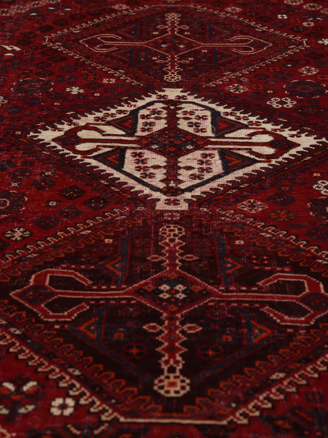 Handmade Shiraz rug from the Middle East in dark-red and dark-blue tones