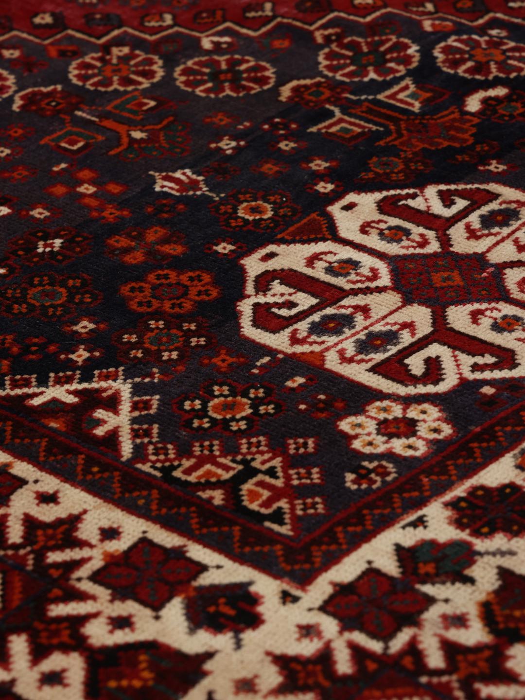 Handmade Shiraz rug from the Middle East in dark-red and dark-blue tones