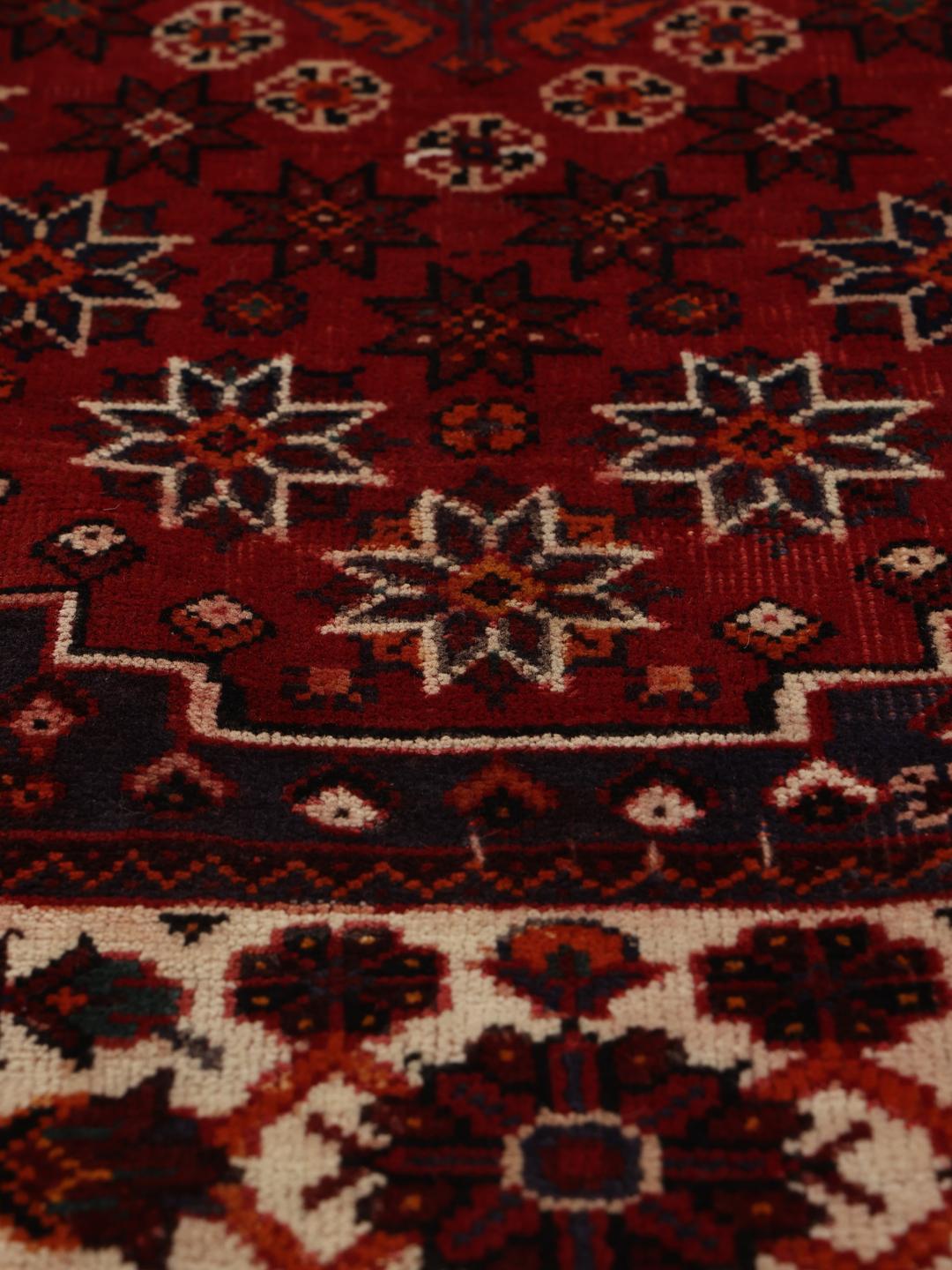 Handmade Shiraz rug from the Middle East in dark-red and dark-blue tones