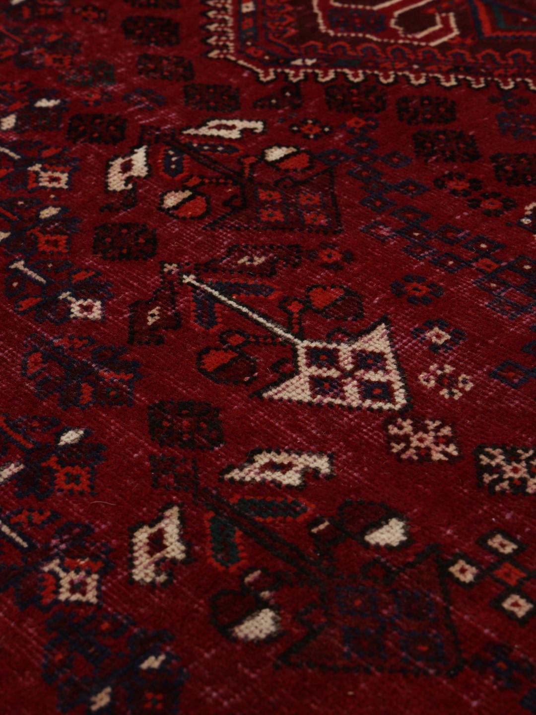 Handmade Shiraz rug from the Middle East in dark-red and dark-blue tones
