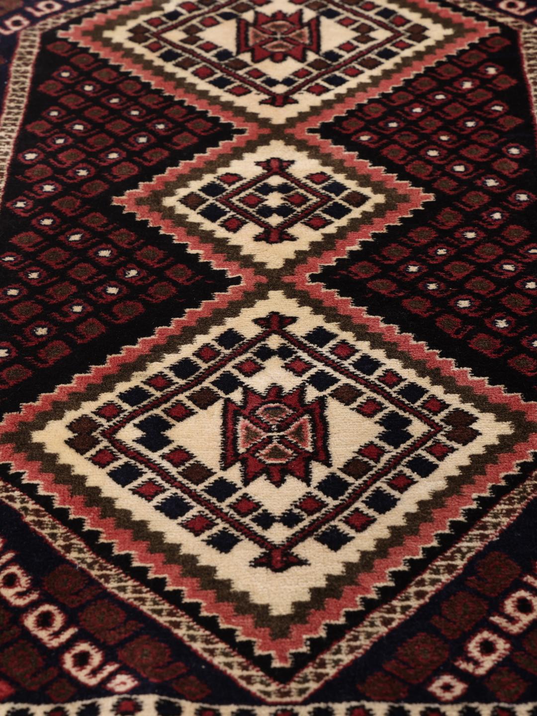 Hand-knotted Afshar Shahre Babak rug from the Middle East in deep red and dark blue.