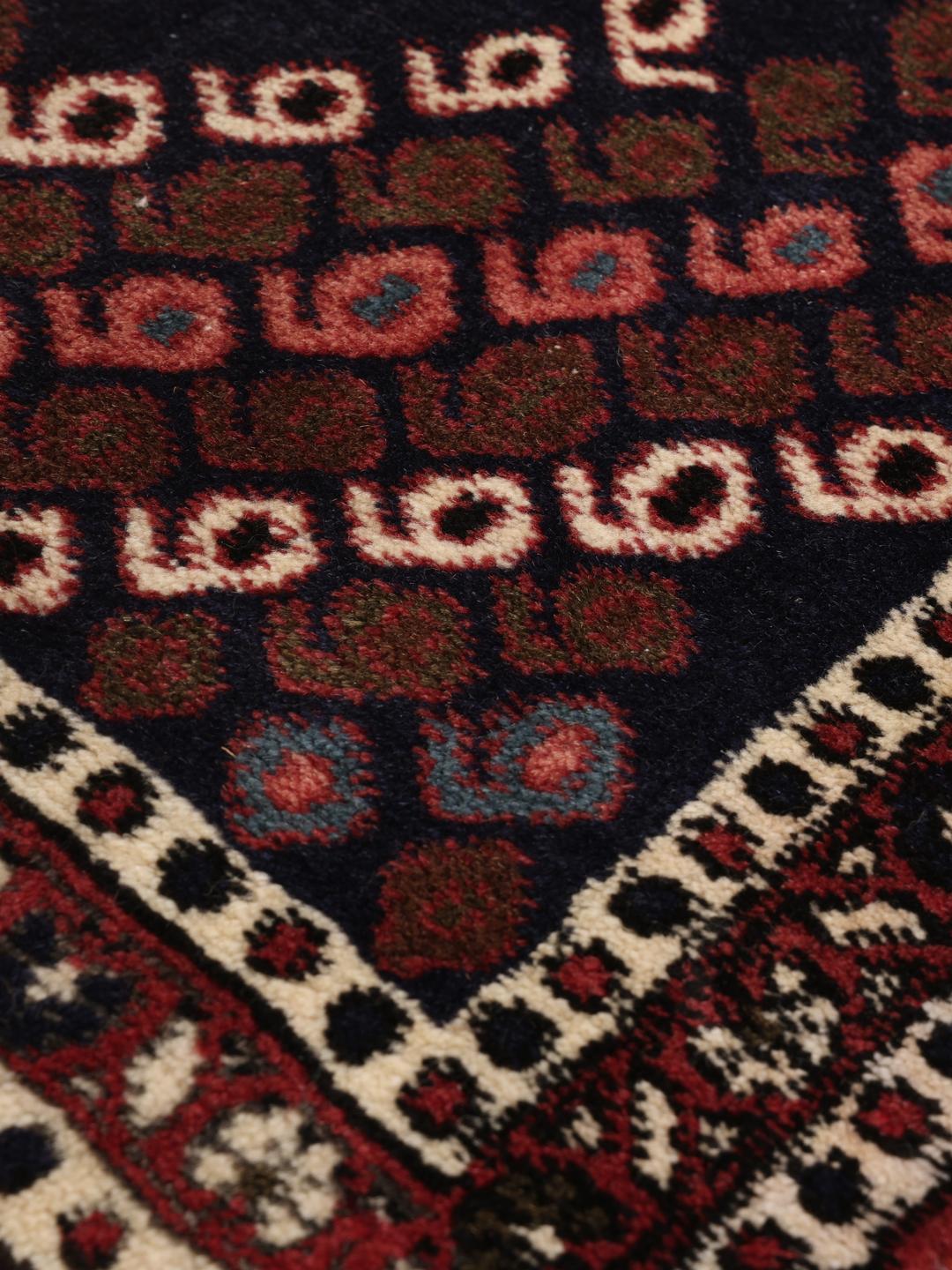 Hand-knotted Afshar Shahre Babak rug from the Middle East in deep red and dark blue.