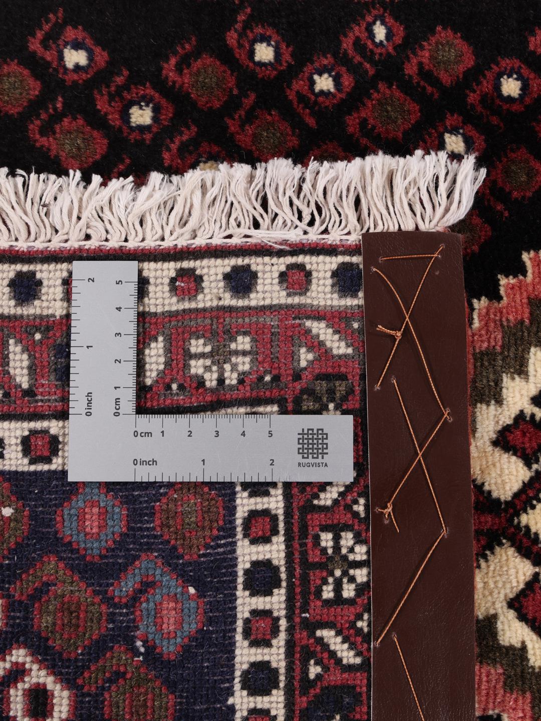 Hand-knotted Afshar Shahre Babak rug from the Middle East in deep red and dark blue.