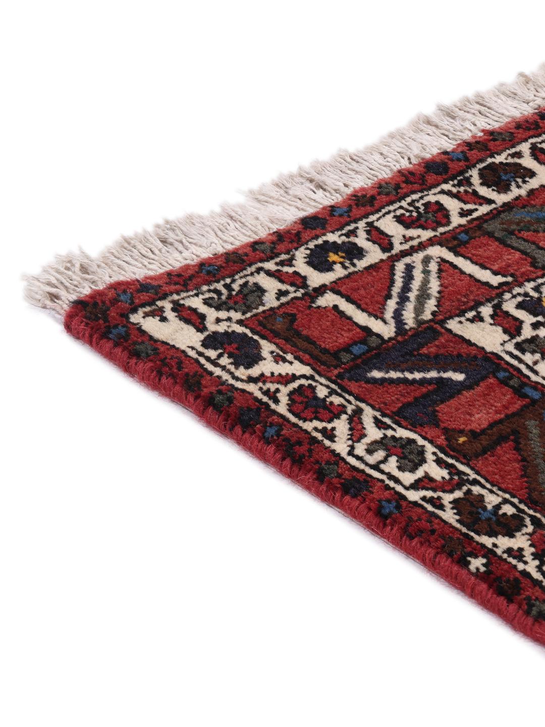 Hand-knotted Afshar Shahre Babak rug with geometric patterns in red and dark tones