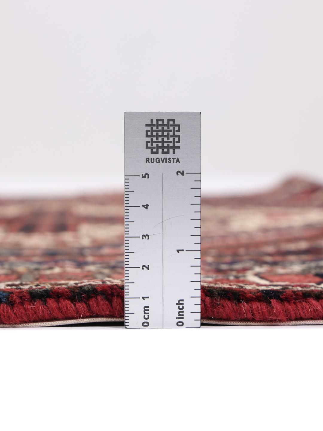 Hand-knotted Afshar Shahre Babak rug with geometric patterns in red and dark tones