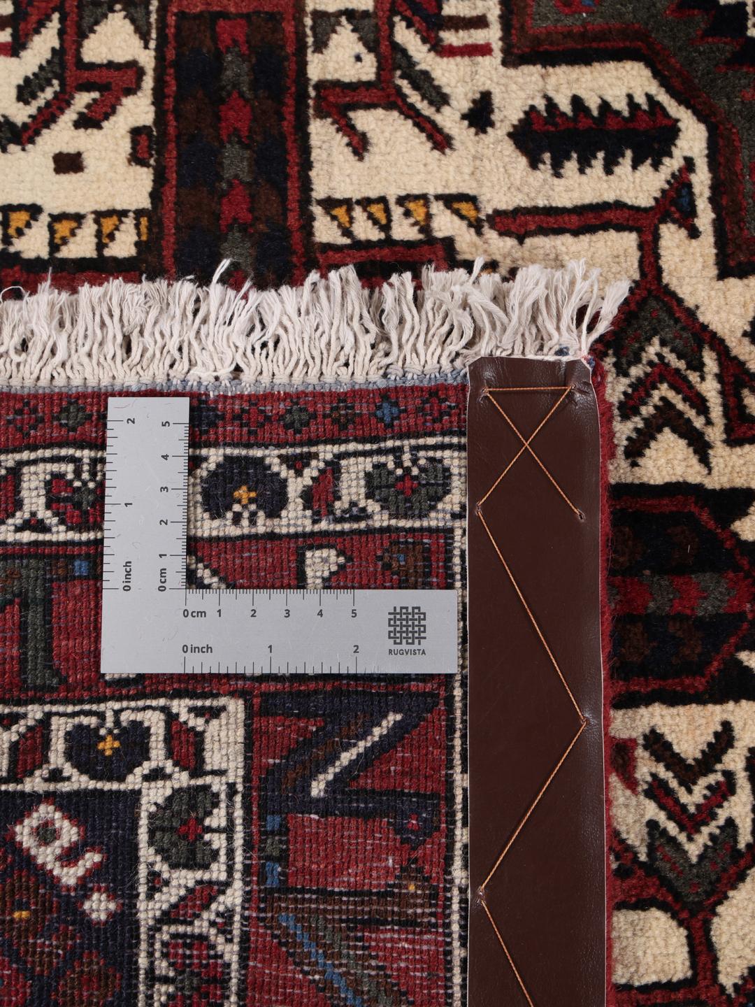 Hand-knotted Afshar Shahre Babak rug with geometric patterns in red and dark tones