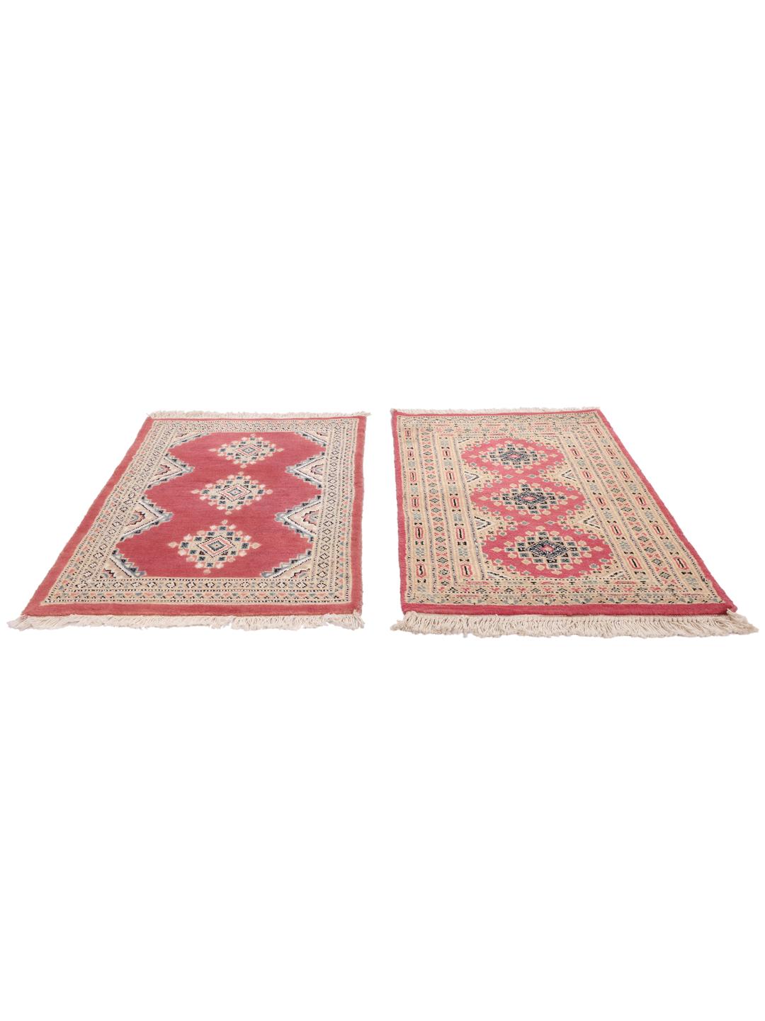 A hand-knotted red Pakistan Bokhara 2ply rug with geometric motifs