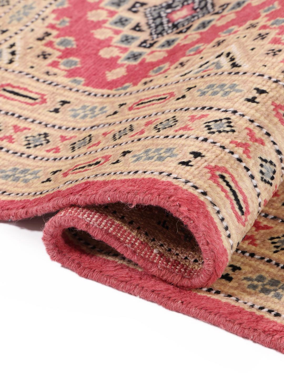 A hand-knotted red Pakistan Bokhara 2ply rug with geometric motifs