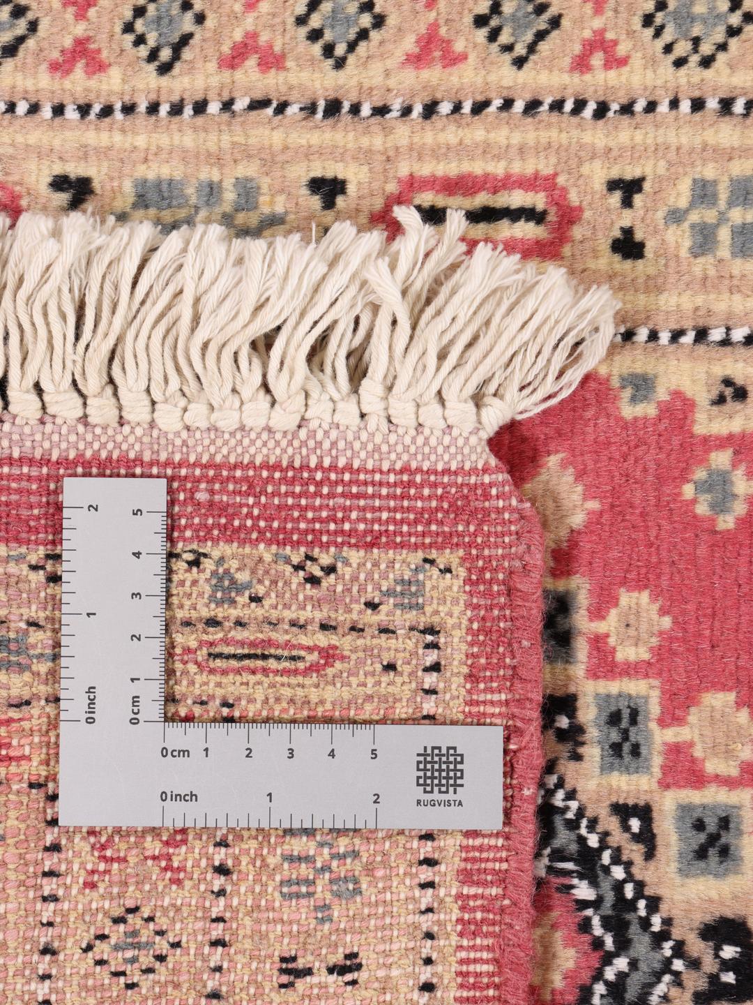 A hand-knotted red Pakistan Bokhara 2ply rug with geometric motifs