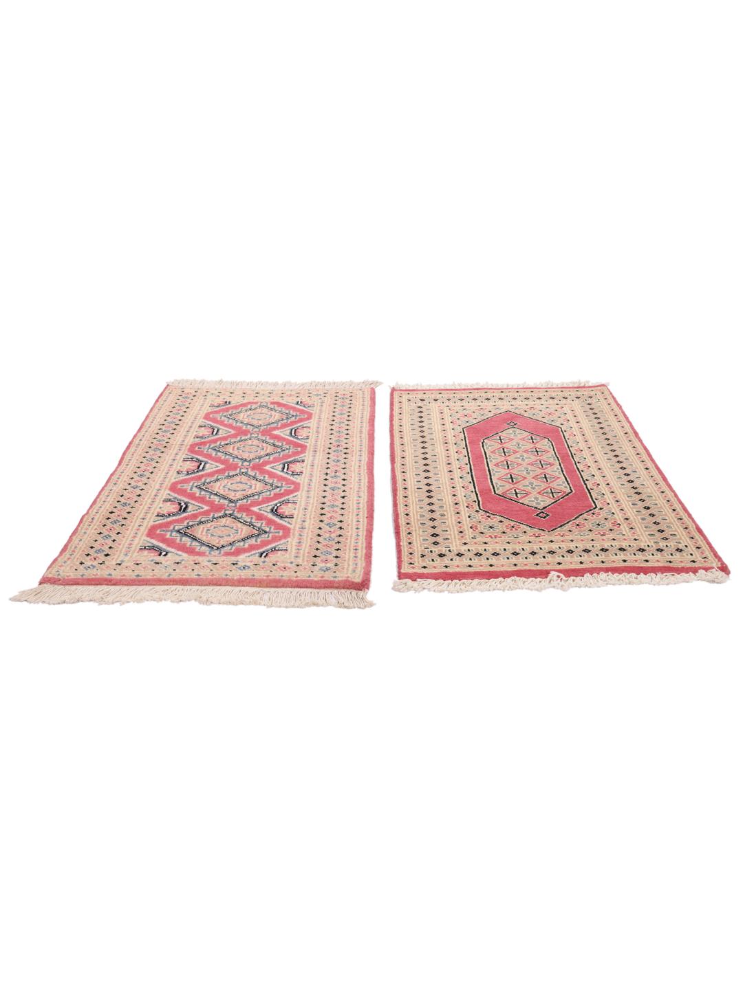 A set of two hand-knotted Pakistan Bokhara Wool rugs in red and beige tones.