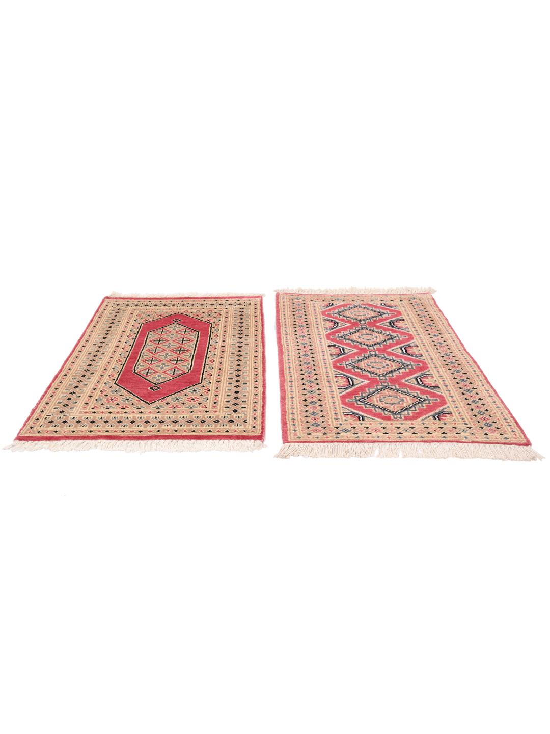 A set of two hand-knotted Pakistan Bokhara Wool rugs in red and beige tones.