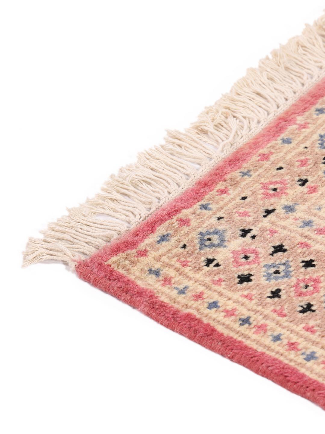 A set of two hand-knotted Pakistan Bokhara Wool rugs in red and beige tones.