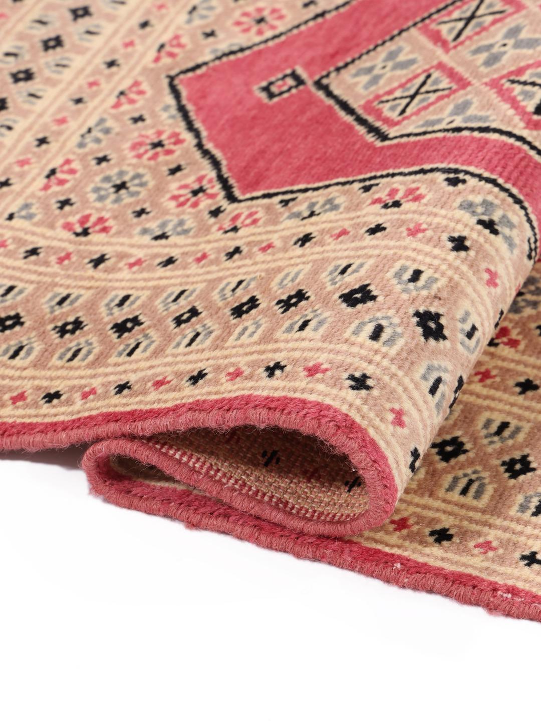 A set of two hand-knotted Pakistan Bokhara Wool rugs in red and beige tones.