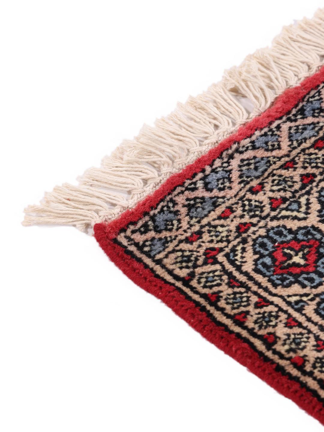 Hand-knotted Pakistan Bokhara rug in red with geometric motifs