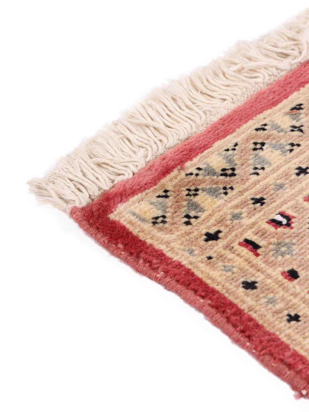 Hand-knotted Pakistan Bokhara 2ply rug with a red field and geometric patterns
