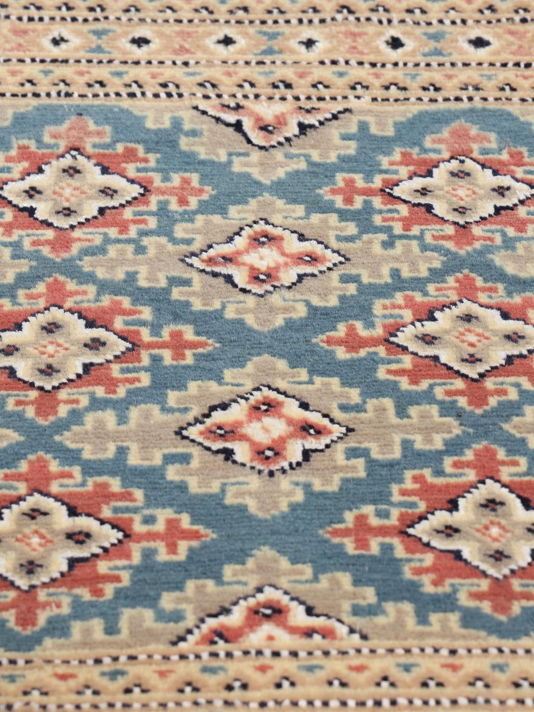 Hand-knotted red and blue Pakistan Bokhara 2ply rug