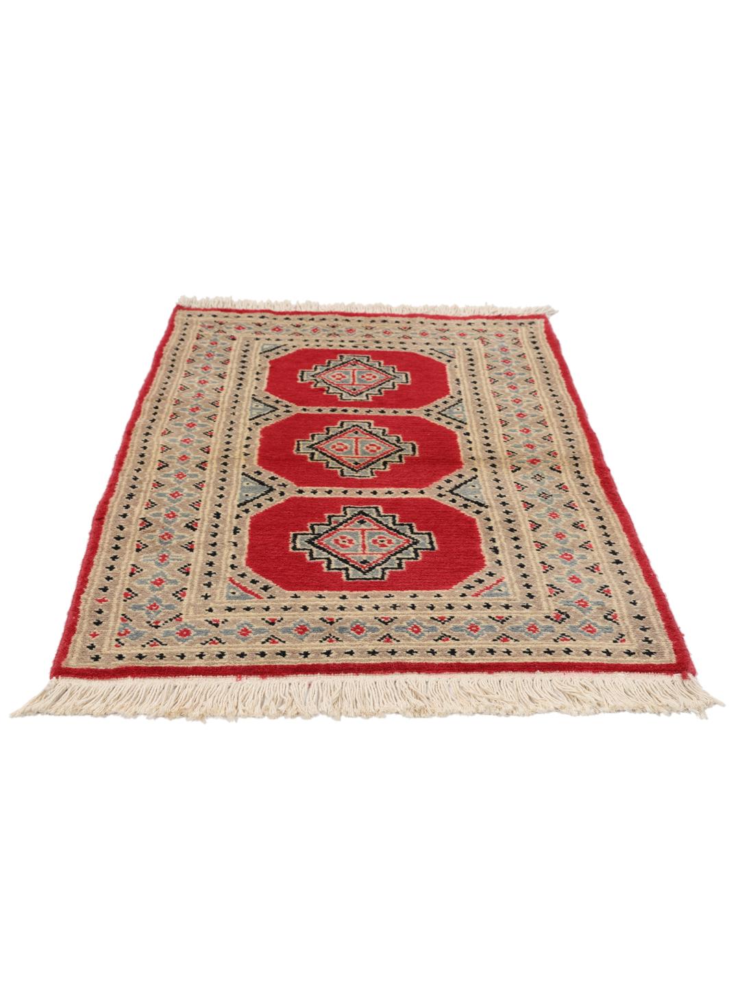 A hand-knotted Pakistan Bokhara 2ply rug with a red field and geometric motifs.
