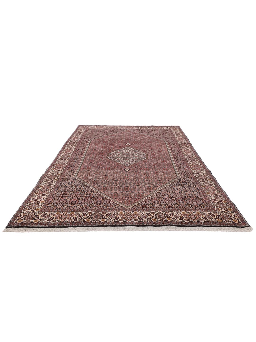 A hand-knotted Bidjar rug from the Middle East in deep red tones.