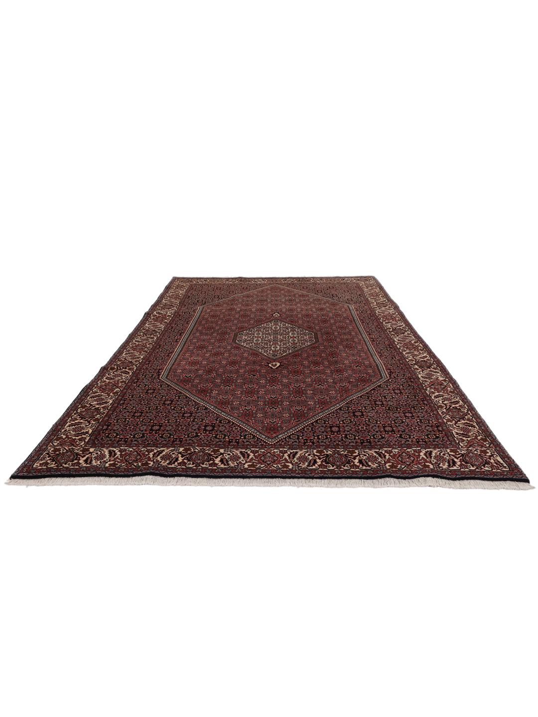 A hand-knotted Bidjar rug from the Middle East in deep red tones.