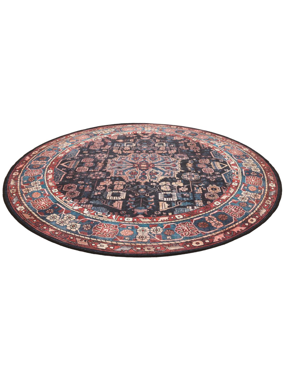 Round rug in blue and black with intricate Oriental patterns
