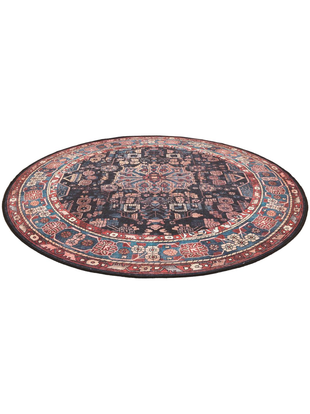 Round rug in blue and black with intricate Oriental patterns