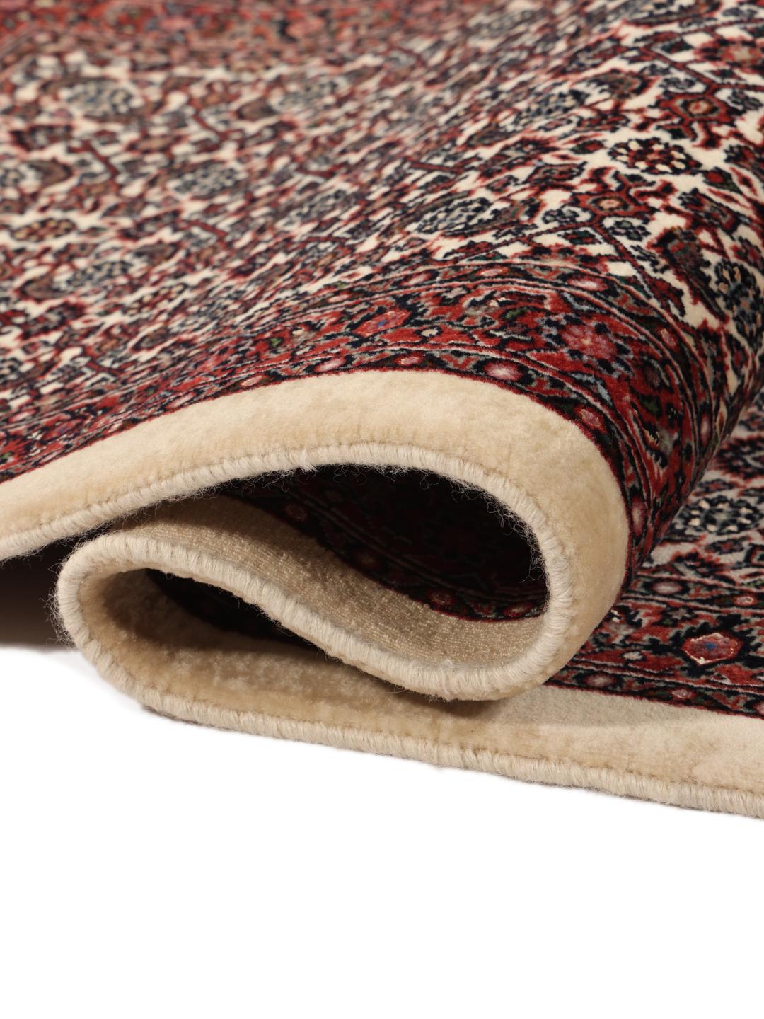 Handgeknoopte Bidjar loper met ingewikkelde bloemmotieven in rode en beige tinten