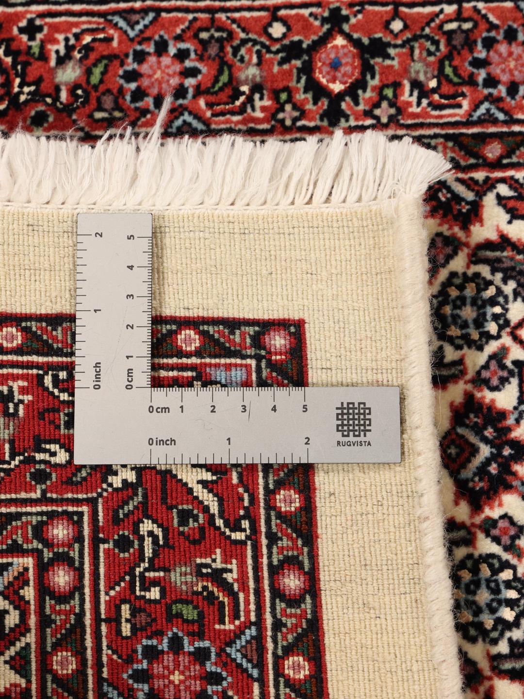 Handgeknoopte Bidjar loper met ingewikkelde bloemmotieven in rode en beige tinten