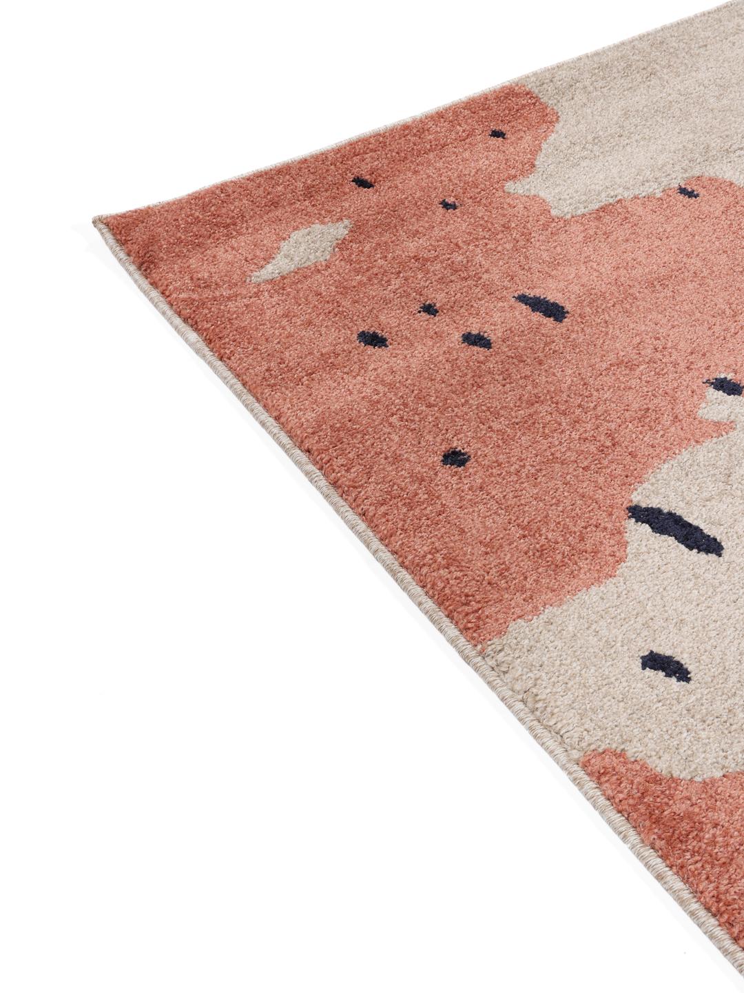 Rechthoekig blauw en beige vloerkleed met een abstract patroon.