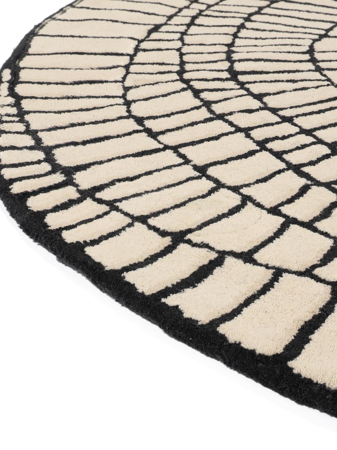 Rond beige en zwart tapijt