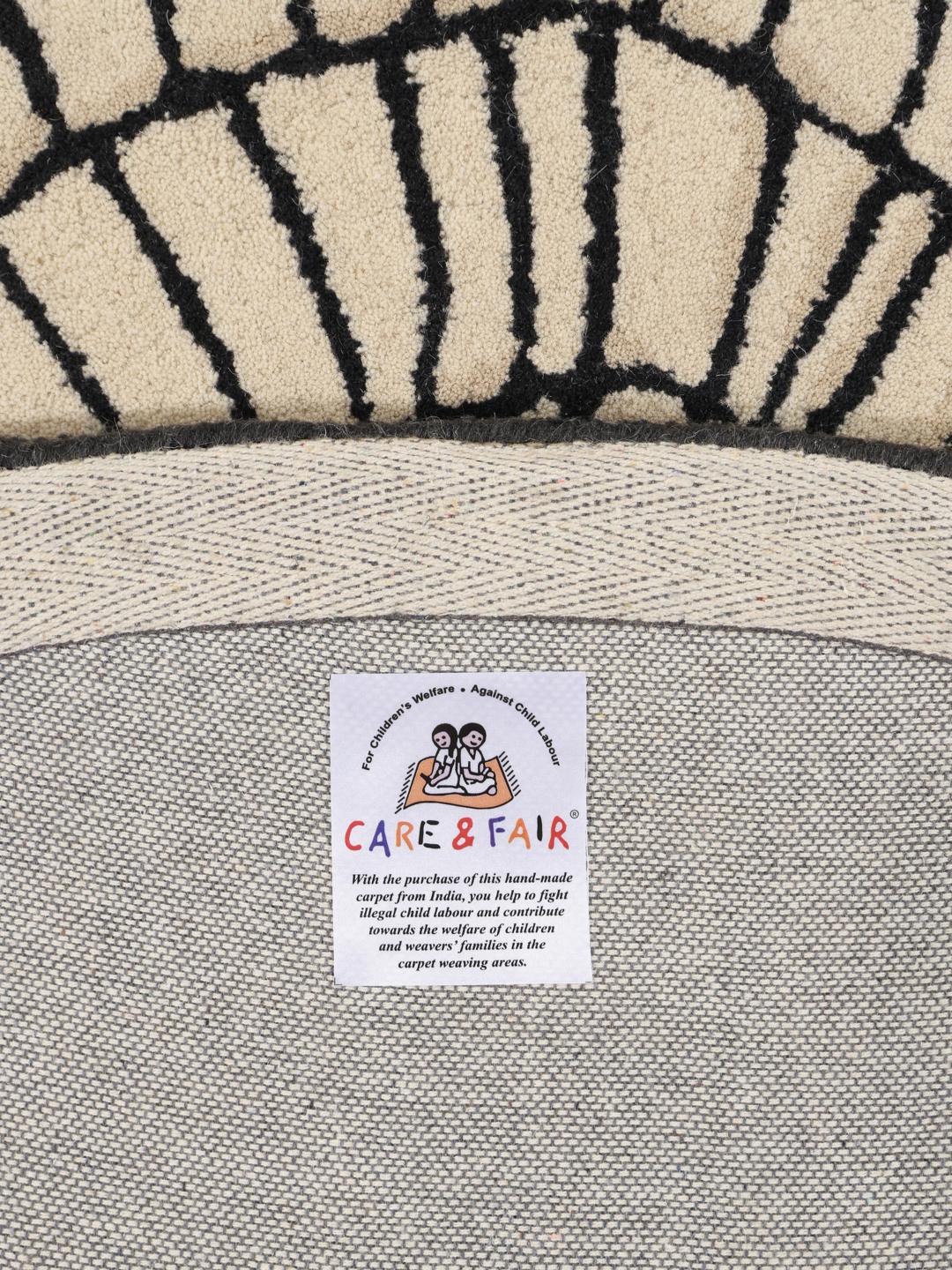 Rond beige en zwart tapijt
