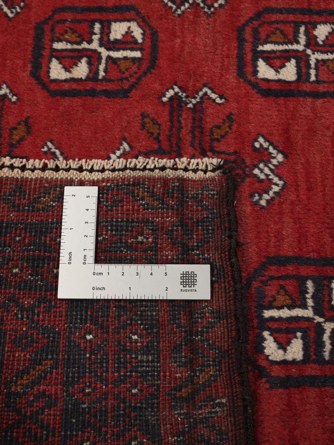 Håndknyttet afghansk Beluch uldløber i dyb rød